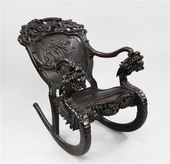A Japanese dragon carved rocking chair,